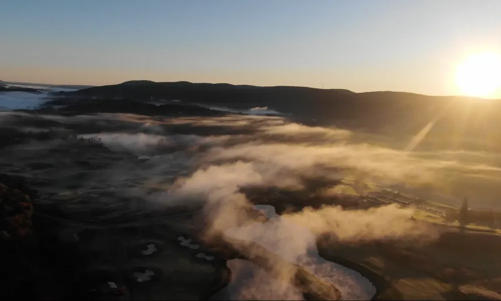 Sun rising over the mountains above a golf resort close to NYC