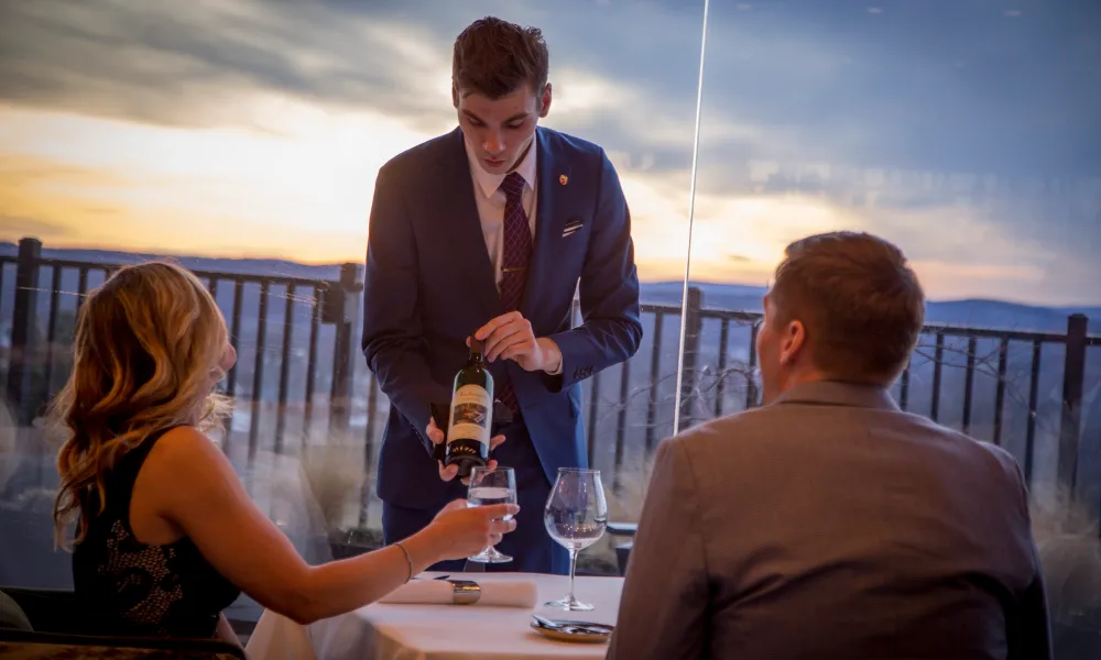 Sommelier serving wine