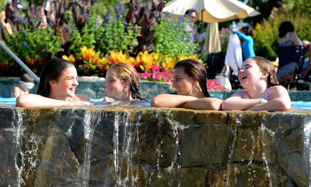 Children laughing while they swim in Vista 180 pool.