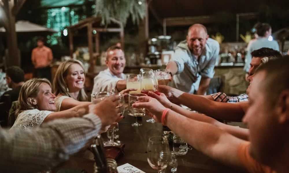 Group of friends toasting at Chef's Garden dinner