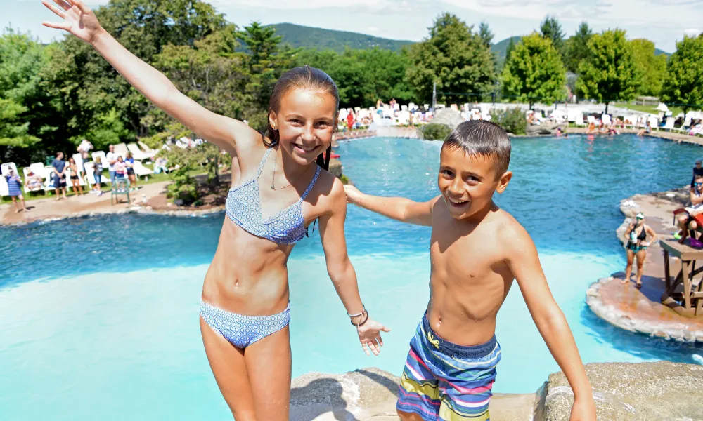 Kids at top of cliff jump at Minerals Pool