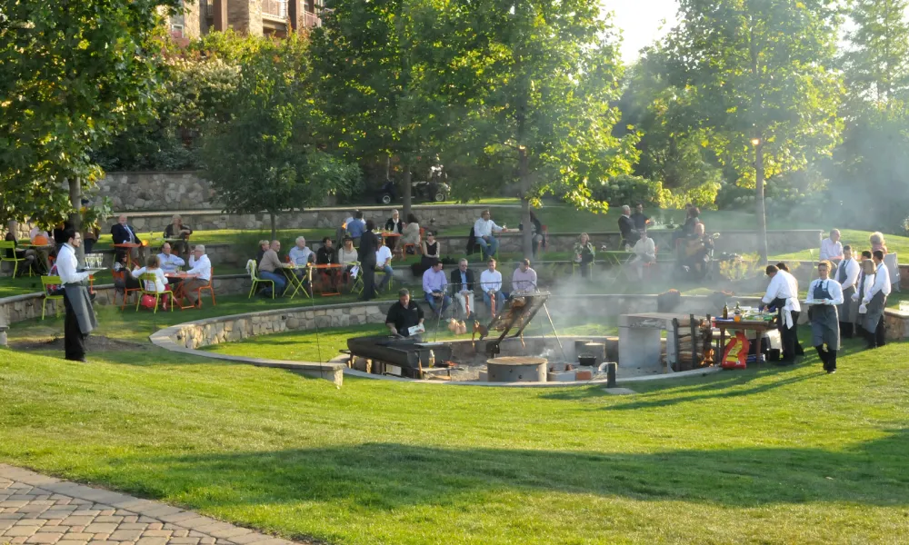 A large group BBQ in the Ampitheater at Grand Cascades Lodge at Crystal Springs Resort