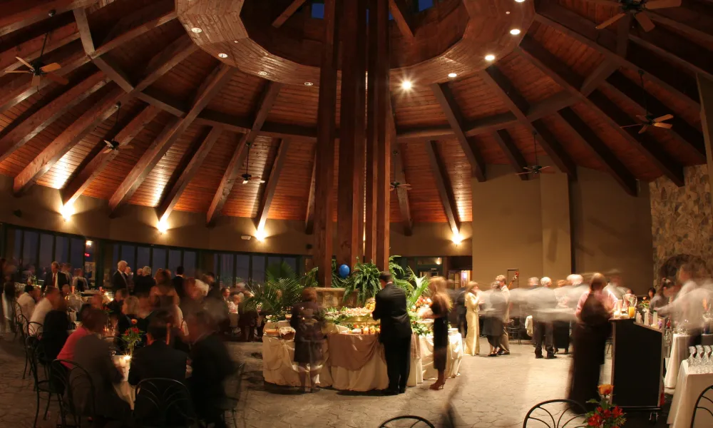 Guests dressed formal for an evening event in the Rotunda at Crystal Springs Resort