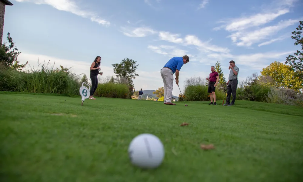 Group Playing Mini Golf at a resort close to NYC