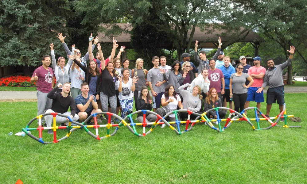 A group posing together after a teambuilding activity at Crystal Springs Resort