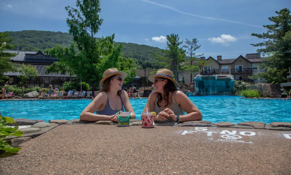 Girlfriends enjoying rum buckets at Minerals Pool