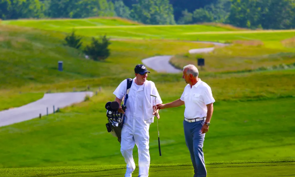 Golfer and Caddy on the course of Ballyowen at Crystal Springs Resort