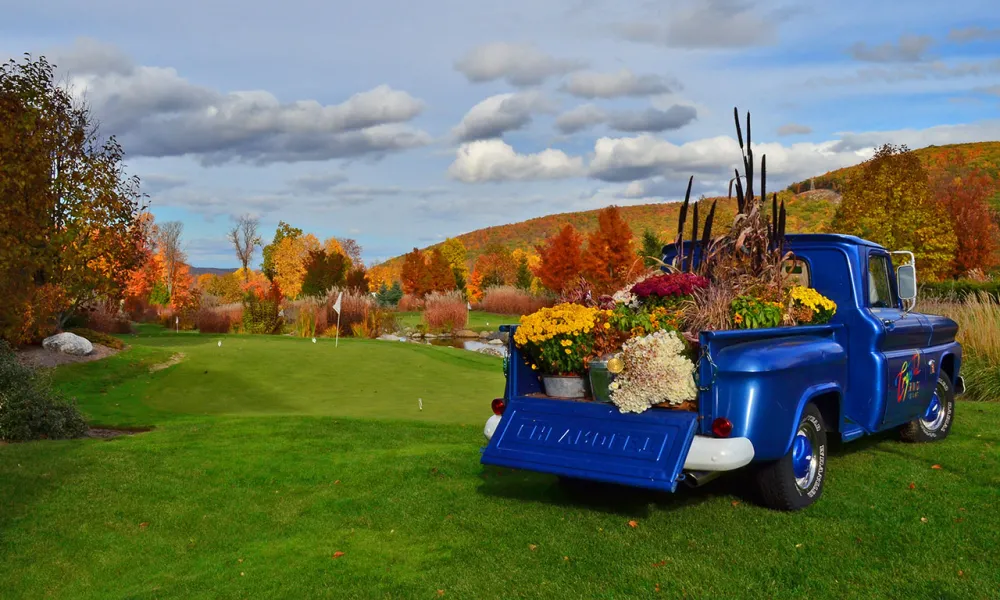 Blue Crystal Springs Resort truck filled with fall flowers