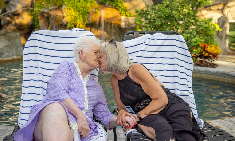 Mother kissing daughter at the Biosphere Pool