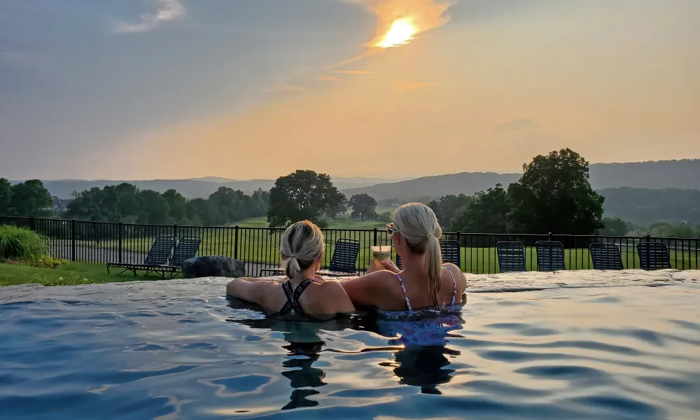 Girlfriends enjoying drinks at Vista 180 pool.