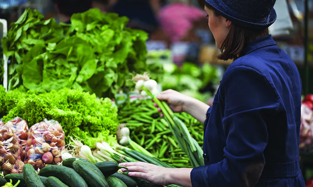 Women shopping for fresh vegetables at farmer's market