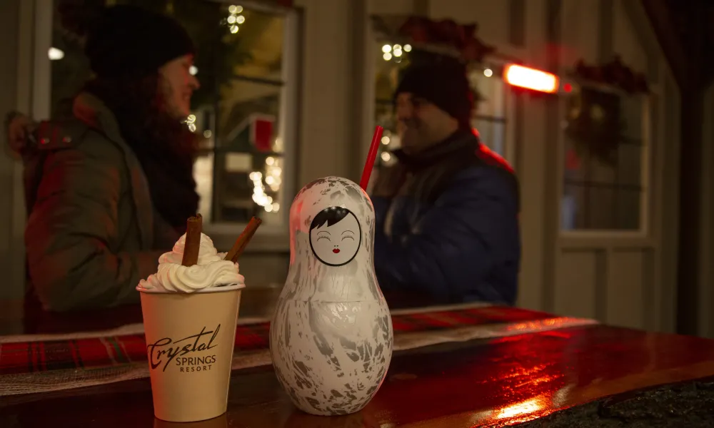 Couple sitting at Frosty's Cantina enjoying hot chocolate.