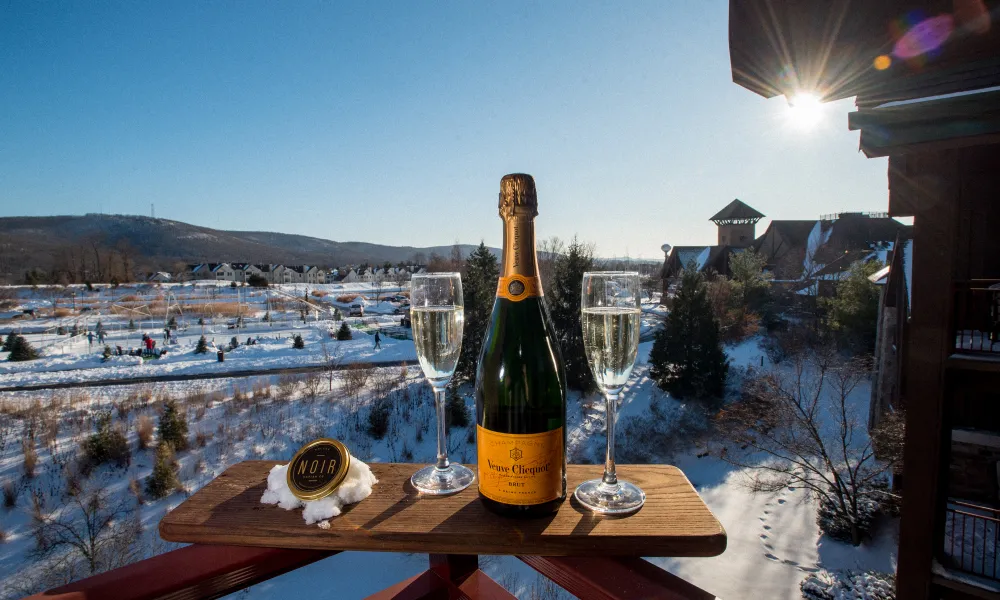 Glass of Champagne on a winter day at Grand Cascades Lodge