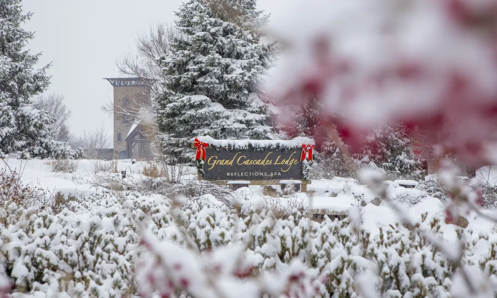 Grand Cascades Lodge entrance sign during the winter season