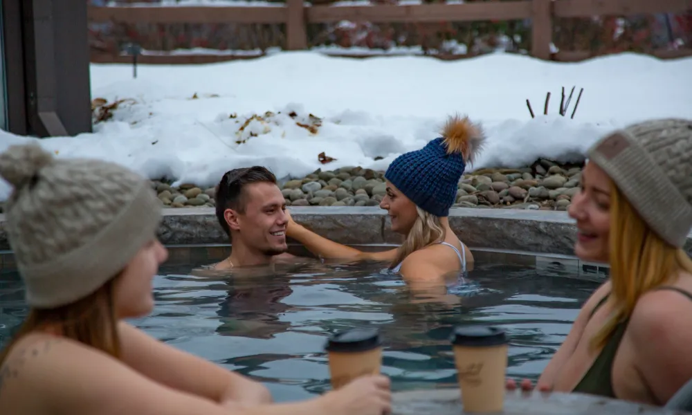 Adults enjoying the snow pool at Grand Cascades Lodge of Crystal Springs Resort in NJ