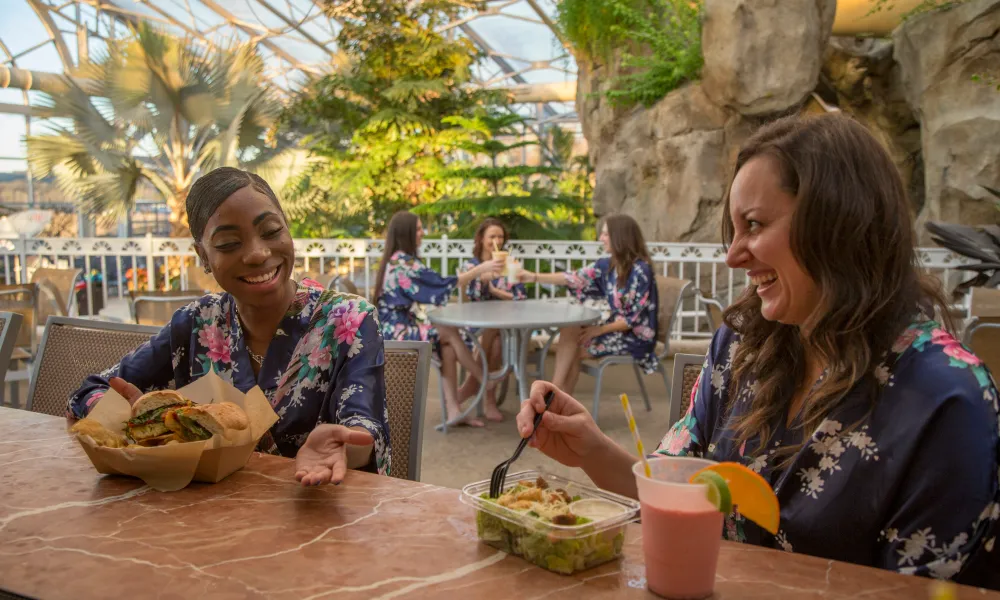 Two women eating at Biosphere cafe.