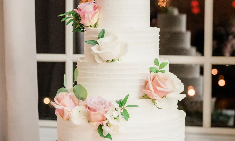 Beautiful wedding cake with pink and white roses