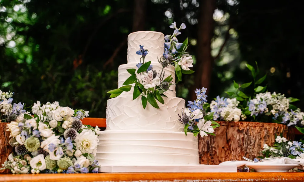 Wedding cake with blue and white flowers 