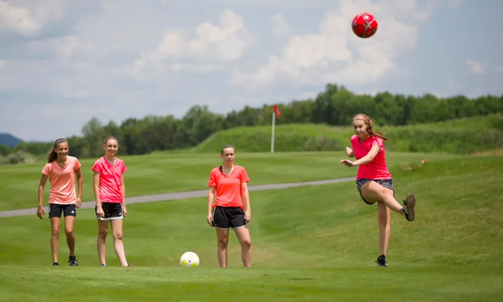 Four girls playing foot golf at a resort close to New York City