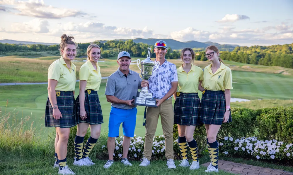 Two winners from the Law Enforcement Open 2022 standing with Ballyowen girls