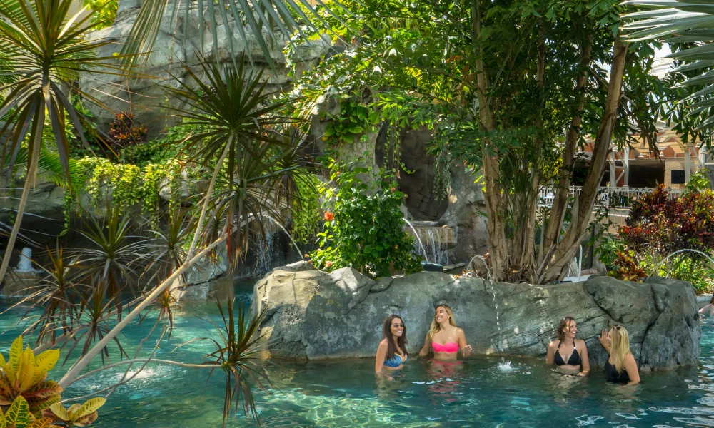 Girlfriends enjoying tropical atmosphere at Biosphere Indoor Pool Complex