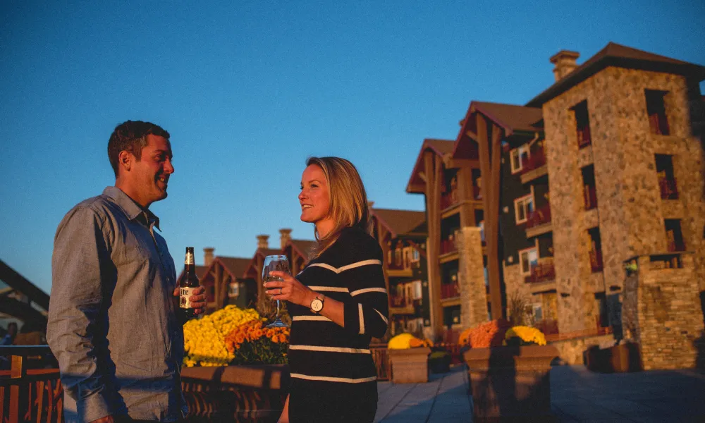 Couple enjoying the sunset on the terrace at Grand Cascades Lodge