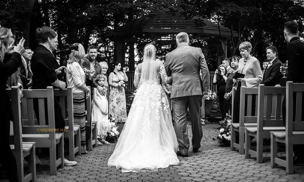 Father walking his daughter down the isle.