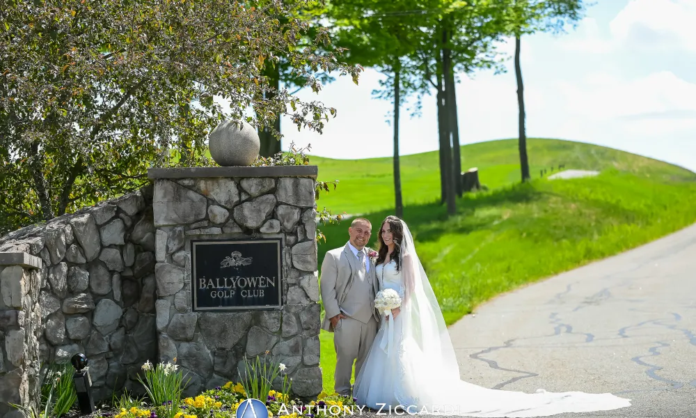 Wedding couple at the entrance to Ballyowen Golf Club