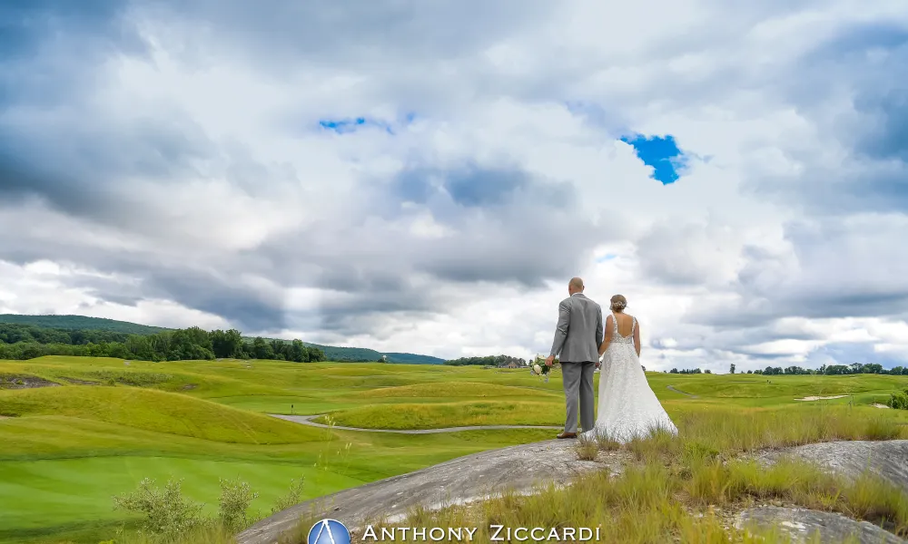 Bride and groom overlooking golf course at Ballyowen