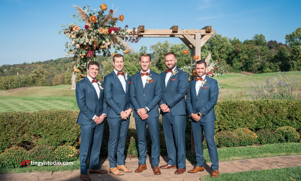 Groomsmen standing in front of alter at a golf course venue