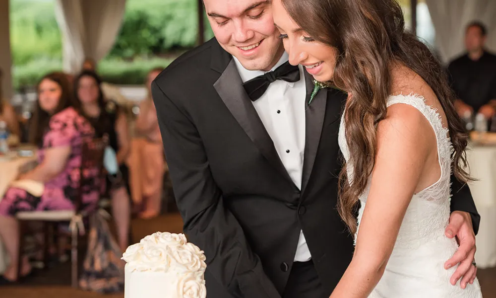 Bride and Groom cutting wedding cake