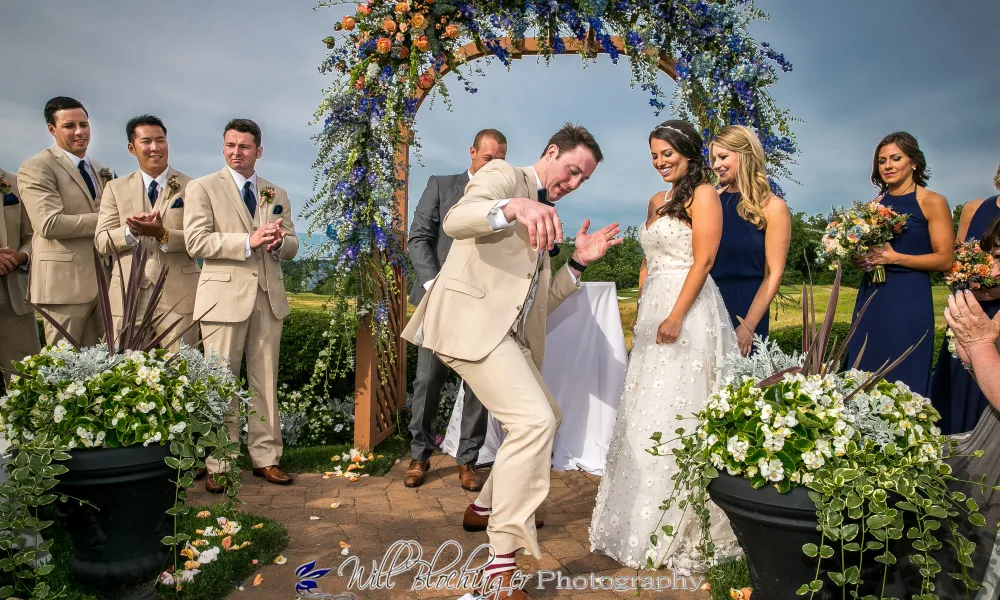 Groom stepping on glass in Jewish wedding ceremony