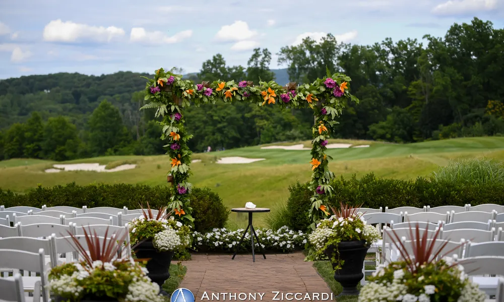 Beautiful flower arbor wedding ceremony set up at Ballyowen golf course