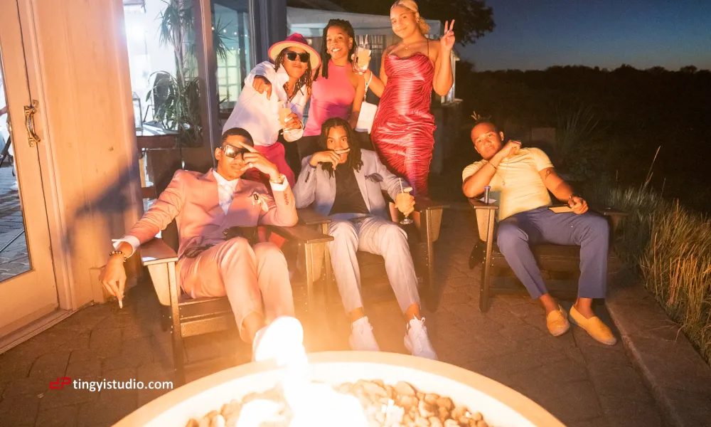 Ballyowen wedding guests sitting by a fire put