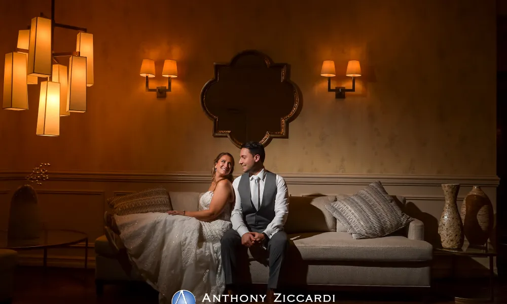 Bride and Groom sitting on couch