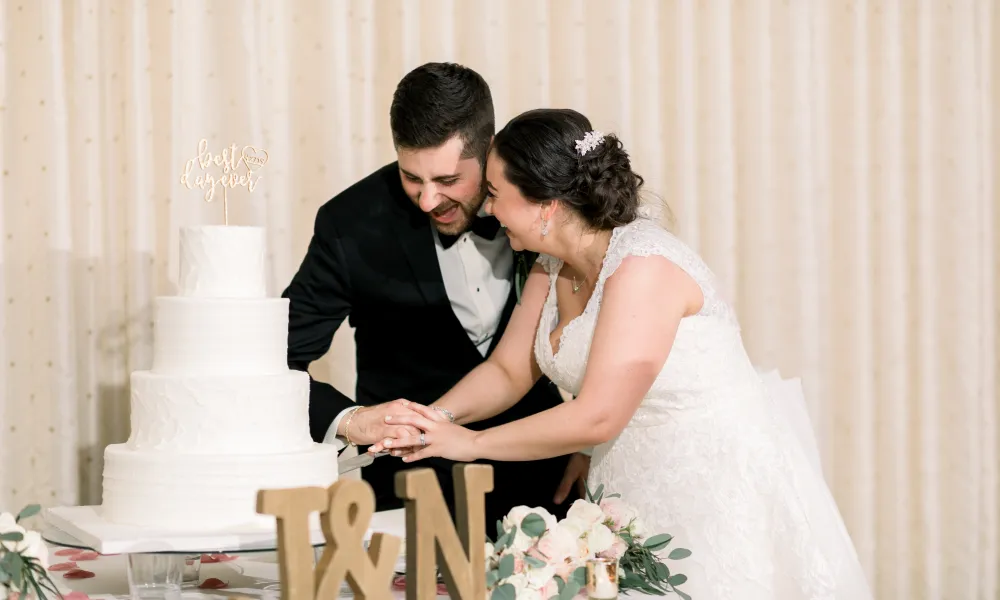 Bride and Groom cutting wedding cake