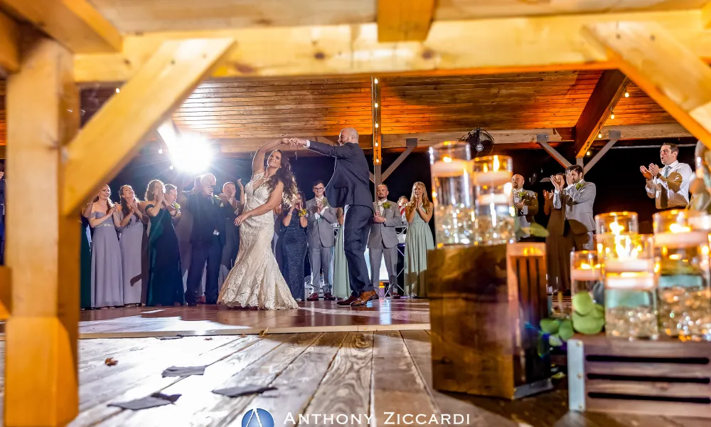 Wedding couple dancing with guests under Sweetgrass Pavilion