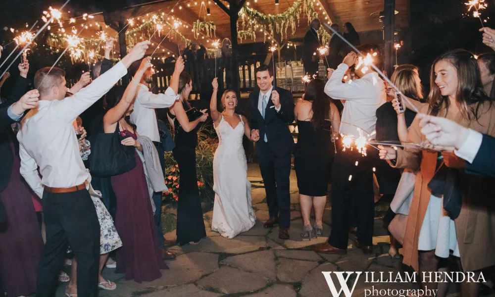 Wedding couple walking through sparklers