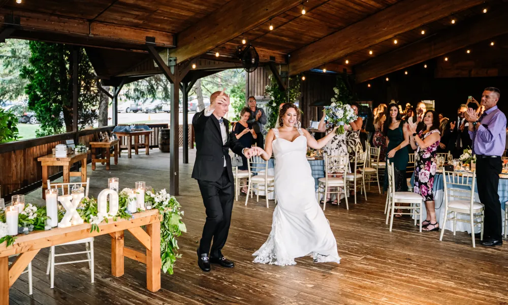 Bride and Groom walking into Sweetgrass Pavilion for entrance