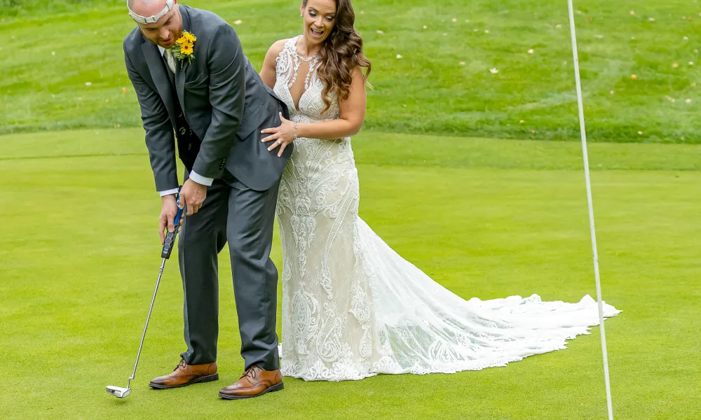 Bride and Groom playing on a golf course