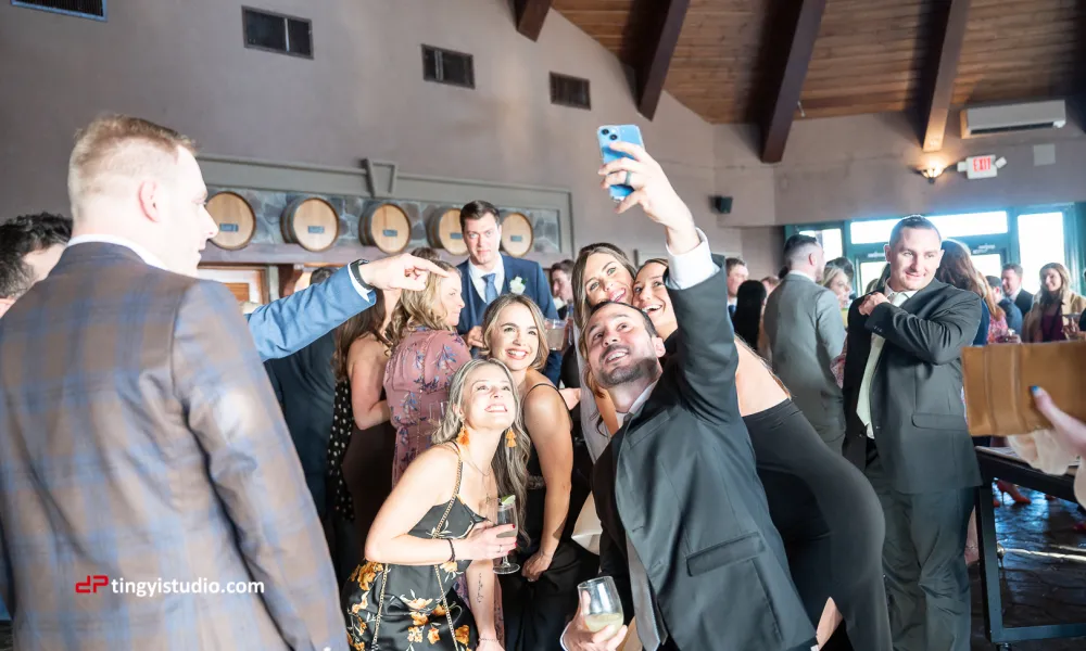 Wedding guests taking selfies