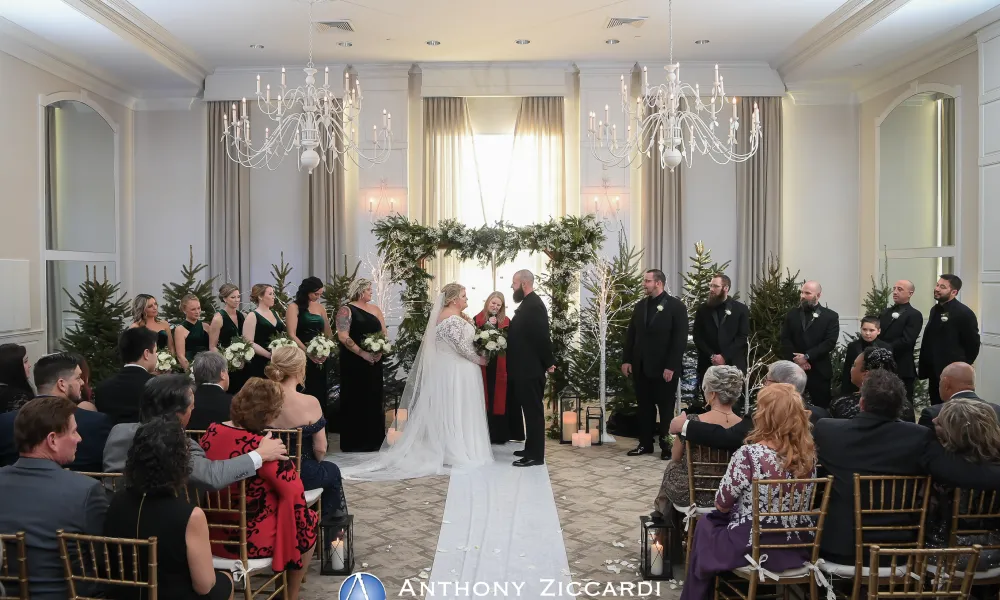 Winter wedding ceremony in the Emerald Ballroom at Crystal Springs Country Club