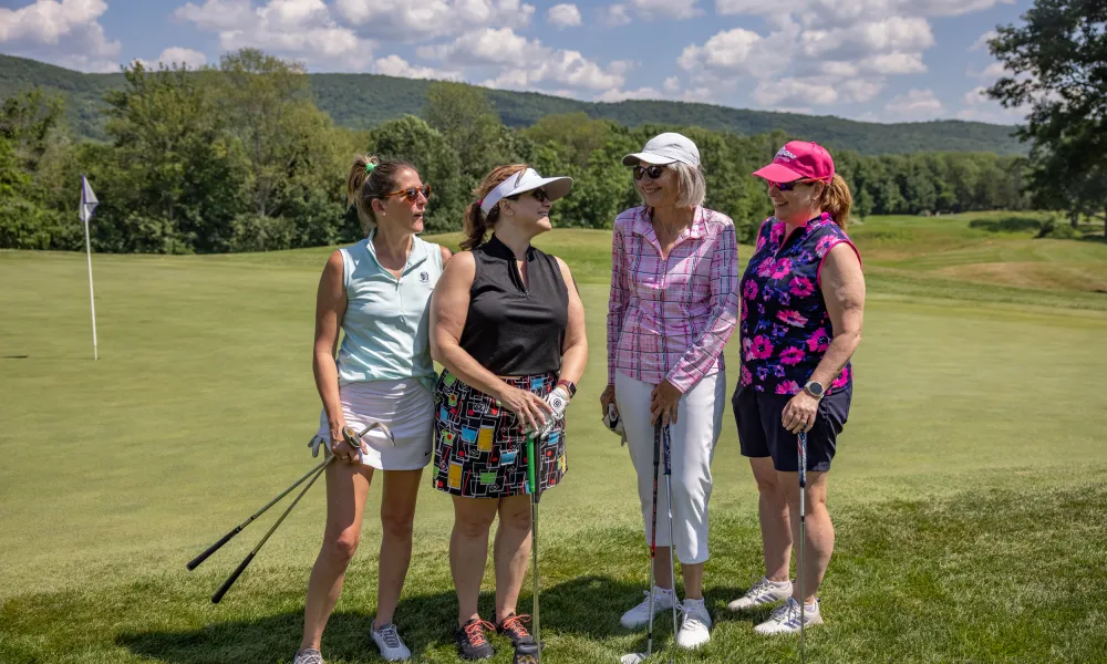 Women foursome on a golf course at Crystal Springs Resort