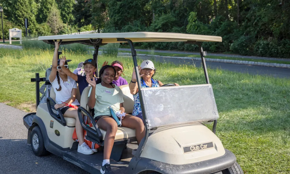 Girls on a golf cart at Crystal Springs Resort