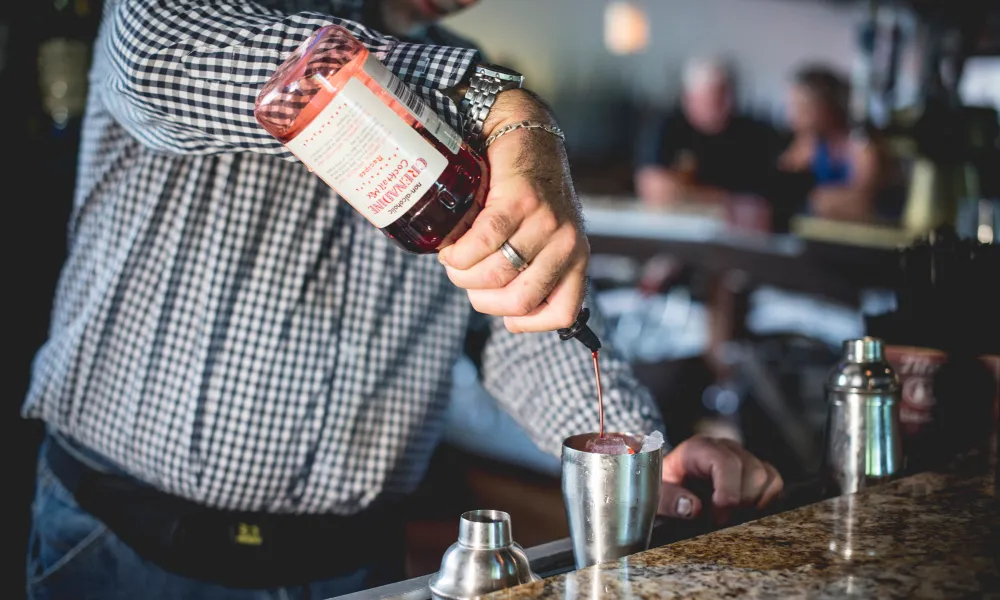 Bartender making a cocktail at Kites Restaurant