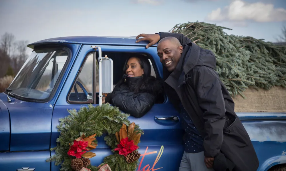 Couple Christmas photo in Crystal Springs Resort blue truck