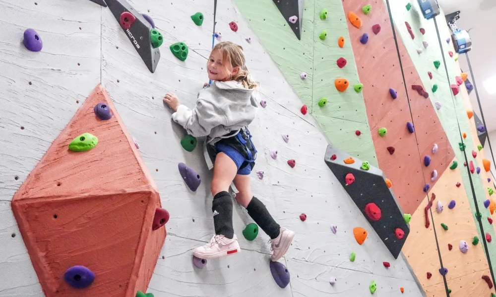 Child rock climbing.