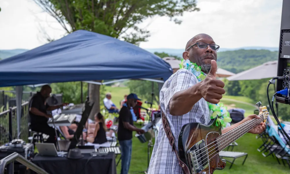 Guitar player giving a thumbs up 