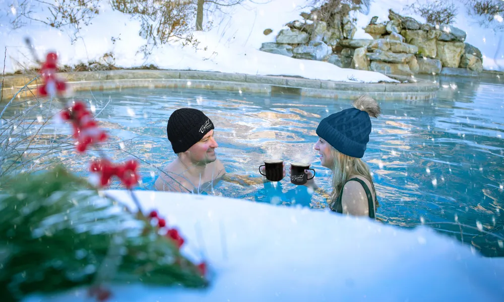 Couple enjoying drinks in the snow pool