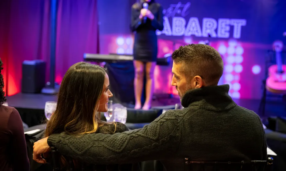 Couple sitting in front of Crystal Cabaret stage.